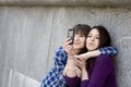 Two urban teen girls taking photo Royalty Free Stock Photo