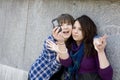 Two urban teen girls taking photo by mobile phone Royalty Free Stock Photo