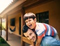 The two of us are having such fun. Cropped portrait of an affectionate young father piggybacking his little son while Royalty Free Stock Photo