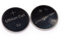 Two used lithium button batteries on white background close-up Royalty Free Stock Photo