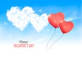 Two valentine heart-shaped baloons in a blue sky with clouds.