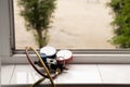 A two-valve manometric manifold lies on the windowsill in the apartment and measures the pressure in the air conditioner at home,