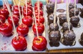 Two varieties of caramel apples. Chocolate and red Royalty Free Stock Photo