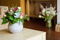 Two vases with flowers in modern interior Royalty Free Stock Photo