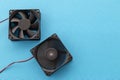 Two vector computer fans rotating and off, close-up on blue background, Royalty Free Stock Photo