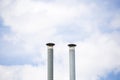 Two ventilation pipes over blue sky Royalty Free Stock Photo