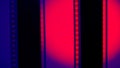 Two vertical film strips on a blue background with red circular light, close up. 35mm film slide frame. Long, retro film Royalty Free Stock Photo