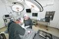 Two veterinarian surgeons in operating room