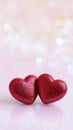 Glittering red hearts symbolizing passion and romantic love on a sparkling pastel background with bokeh lights Royalty Free Stock Photo