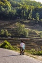 Two village boys walking at the side of a dirty path next to the rice terraces at Yuanyang Royalty Free Stock Photo