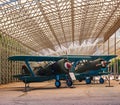 Two vintage airplanes in hangar