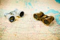 Two vintage binoculars on old map Royalty Free Stock Photo