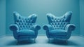 Two vintage blue tufted armchairs in an empty room with blue walls. Royalty Free Stock Photo