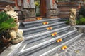 Flowers decorate a stairway leading to a temple entrance in Bali Indonesia