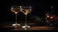 Two vintage champagne glasses on a dark background of the lux served table Royalty Free Stock Photo