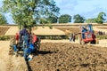 Two Vintage Massey Ferguson ploughing on stubble in crop field Royalty Free Stock Photo