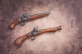 Two vintage duel pistols on wooden background Royalty Free Stock Photo