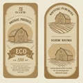 Two vintage-style labels feature illustrations of a barn set against a backdrop Royalty Free Stock Photo