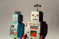 Two vintage tin toy robots, robotic delivery, artificial intelligence concept Royalty Free Stock Photo