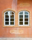 Two vintage window on orange cement wall Royalty Free Stock Photo