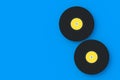 Two vinyl records on blue background Royalty Free Stock Photo