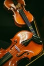 Two violins on some chairs Royalty Free Stock Photo