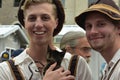 Two Visitors Interact with Rescue Kitten from Nashville Cat Rescue at Oktoberfest Event