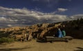 Two visitors sitting on bench watching beautiful view of Bryce Canyon