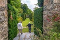 Two visitors in the topiary garden of Plas Brondanw, North Wales
