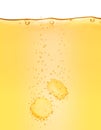 Two vitamins pills dissolves in yellow water close-up on white Royalty Free Stock Photo