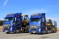 Two Volvo FH13 Trucks Hauling Ponsse Forestry Machinery