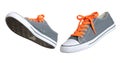 Two walking grey sneakers