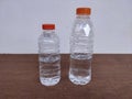 Two water bottles of different sizes Royalty Free Stock Photo