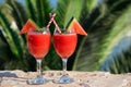 Two watermelon smoothie on summer holidays by the sea.