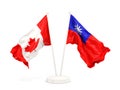 Two waving flags of Canada and Taiwan isolated on white