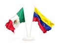 Two waving flags of Mexico and venezuela isolated on white