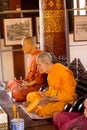 Two Wax monks sculptures in buddhist temple in Chiang Mai, Thailand
