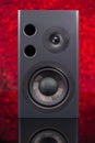 Two way audio speaker on red defocused background Royalty Free Stock Photo