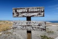 Two Wooden Signs, Santa Cruz Island, Channel Island, California, with Blue Sky and Dry Landscape in the Background