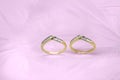 Two Wedding Bands On A Pink Background Royalty Free Stock Photo