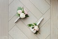 Two wedding buttonhole made of white roses Royalty Free Stock Photo