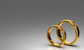 Two wedding gold rings on dark blank background. Love concept Royalty Free Stock Photo