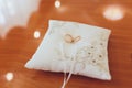 Two wedding gold rings lying on silk lace cushion for rings. Wedding accessories bride and groom before the ceremony Royalty Free Stock Photo