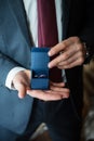 Two wedding rings in the hands of a ring bearer Royalty Free Stock Photo