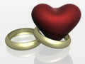 Two wedding rings with heart. Royalty Free Stock Photo