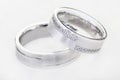 Two wedding rings isolated on white Royalty Free Stock Photo