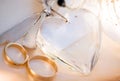 Two wedding rings a love heart and a flower Royalty Free Stock Photo