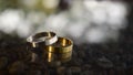 Two wedding rings Luxurious gold and silver On the wooden floor