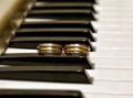 Two wedding rings on piano Royalty Free Stock Photo