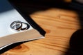 Two wedding rings are placed on the open Bible placed on the table as wedding rings prepared for lovers to wear and read Bible Royalty Free Stock Photo